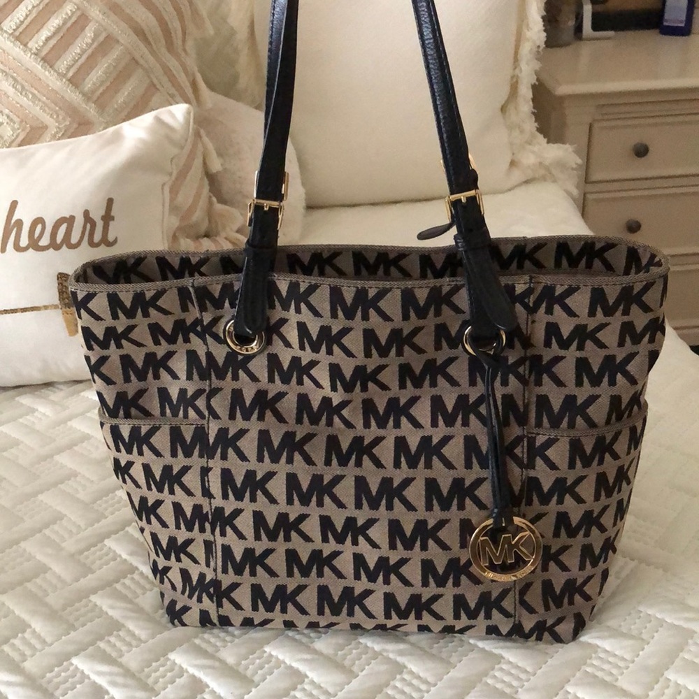 Beige with black MK on it